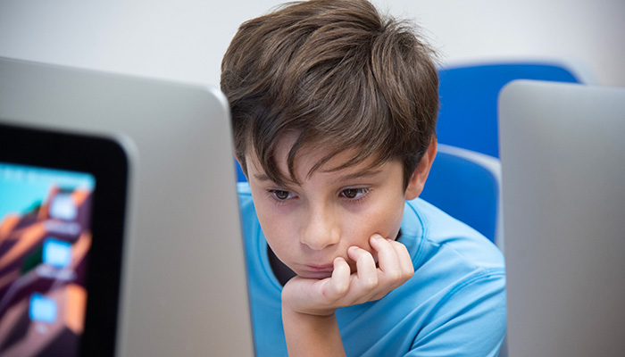 boy working in computer lab