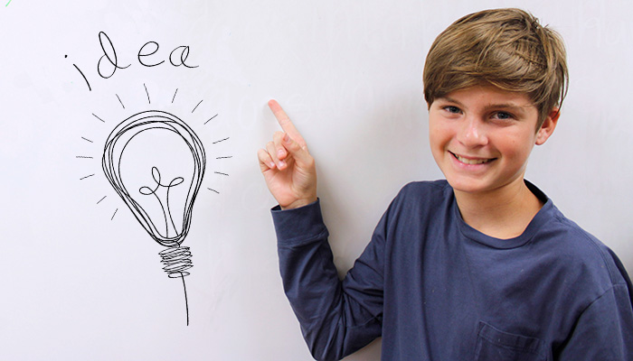 boy at white board