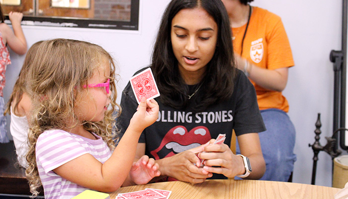 2 girls playing cards