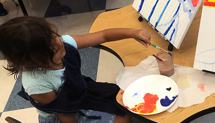 young girl painting art