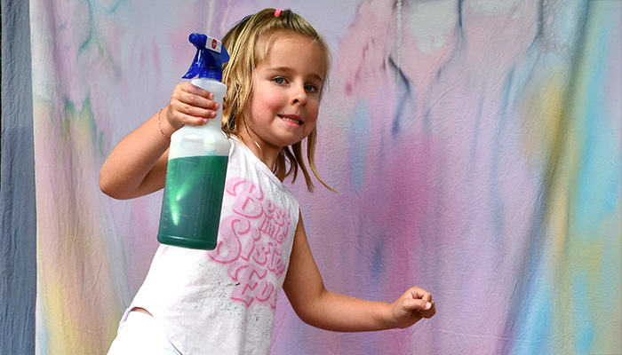 girl painting a white sheet