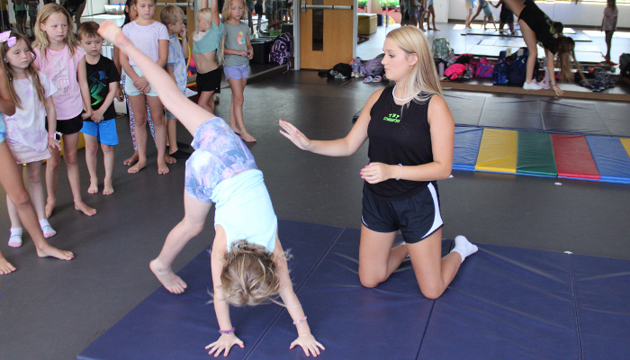 girl practicing cartwheel