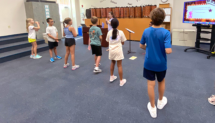 kids singing in music room